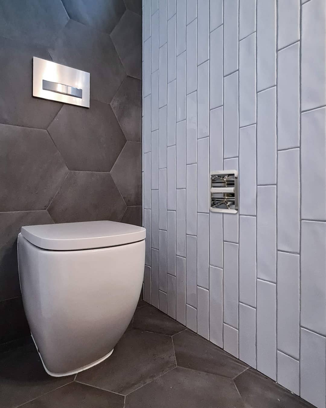 SmartRoll installed in designer bathroom with hexagon tiles